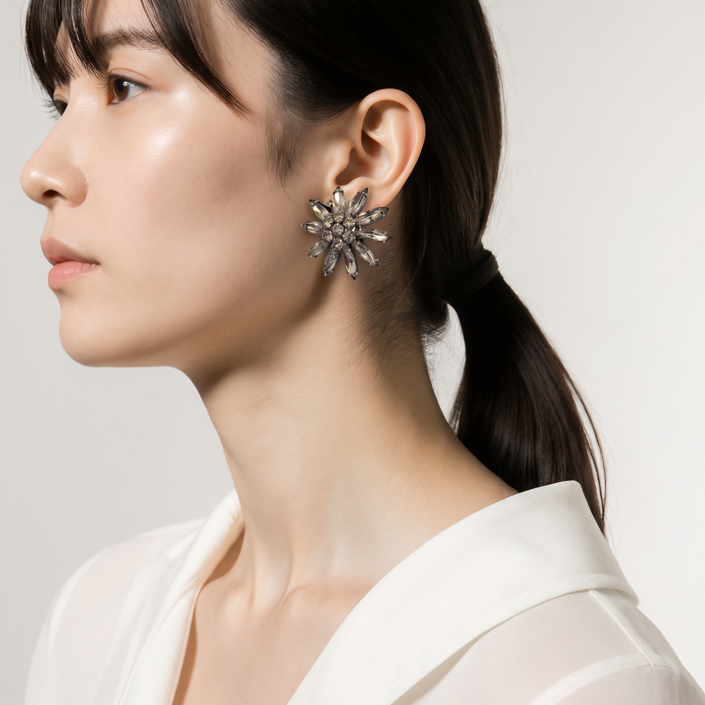 The Silver Crystal Bloom Earrings.