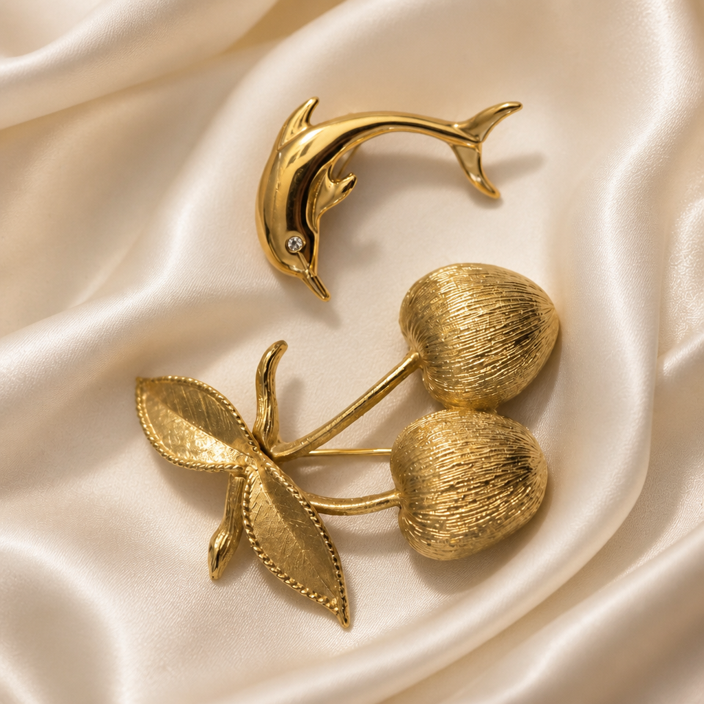 The Sarah Coventry Cherry & Dolphin Brooch.