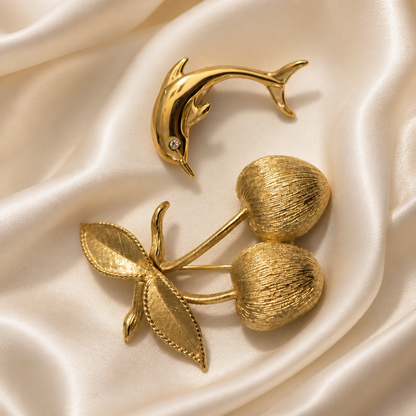 The Sarah Coventry Cherry & Dolphin Brooch.