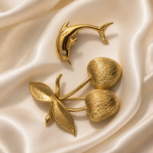 The Sarah Coventry Cherry & Dolphin Brooch.