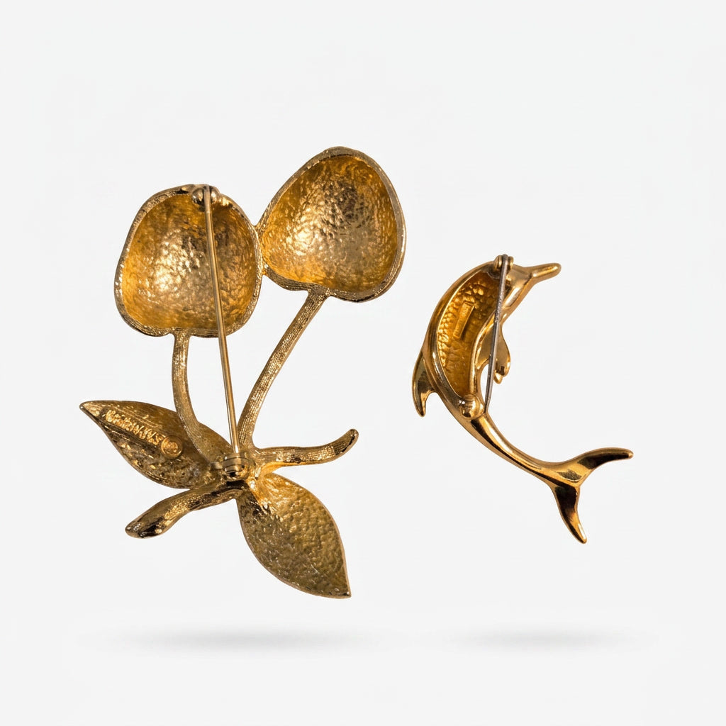 The Sarah Coventry Cherry & Dolphin Brooch.
