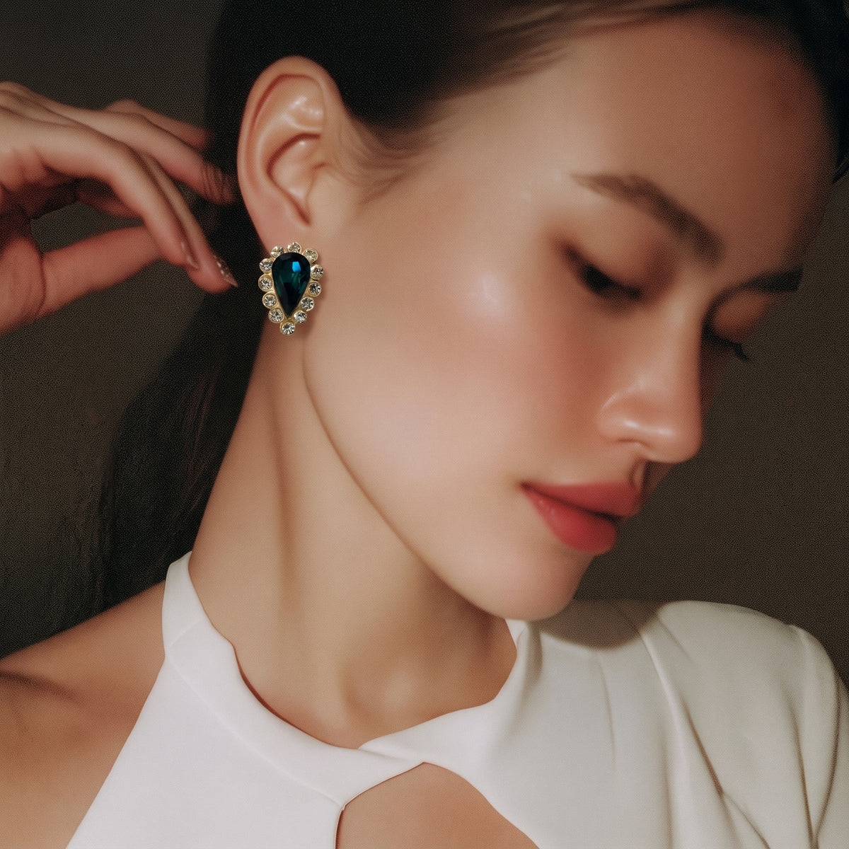 The Emerald Teardrop Halo Earrings.